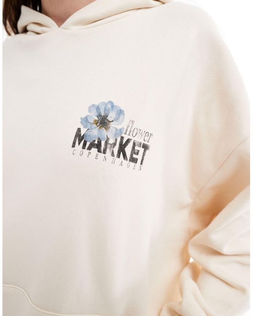 Sudadera color extragrande con capucha y estampado floral y texto "market" ASOS de color White