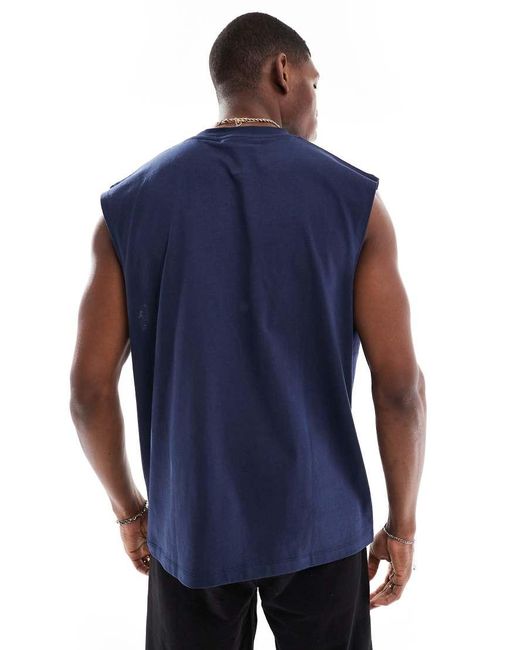 Camiseta Azul Marino Extragrande Sin Mangas Con Estampado Gráfico Deportivo De ASOS de hombre de color Blue