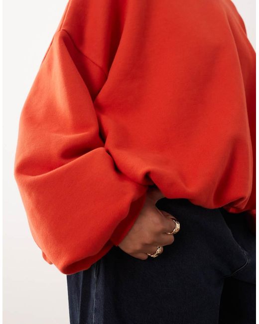 ARRANGE Red Curve Bubble Hem Sweatshirt