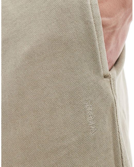 Pantaloncini color pietra slavato con bordi grezzi di Bershka in Natural da Uomo