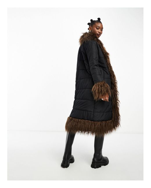Manteau doudoune long avec bords en fausse fourrure marron Native Youth en coloris Black