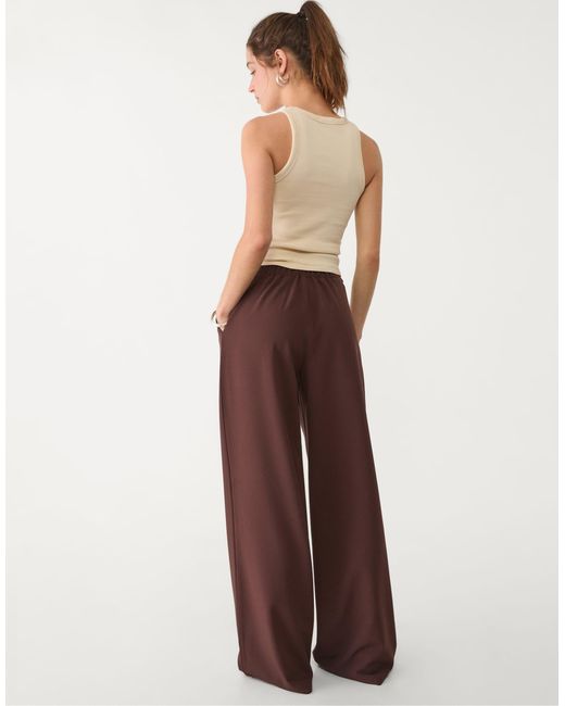 Pantalon ample et habillé avec boucle Stradivarius en coloris Brown