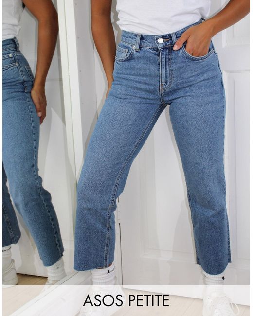 Asos design petite - jeans a zampa corti a vita alta elasticizzati e facili  da indossare lavaggio medio vintageASOS in Denim di colore Blu | Lyst