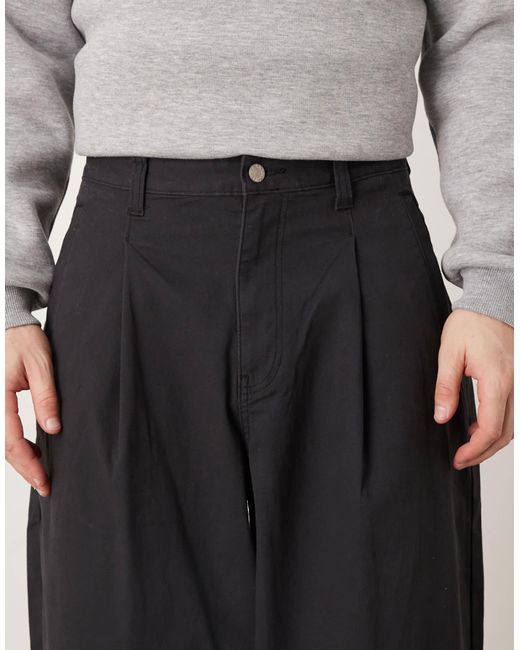 Pantalon oversize coupe baggy à pinces ASOS pour homme en coloris Black