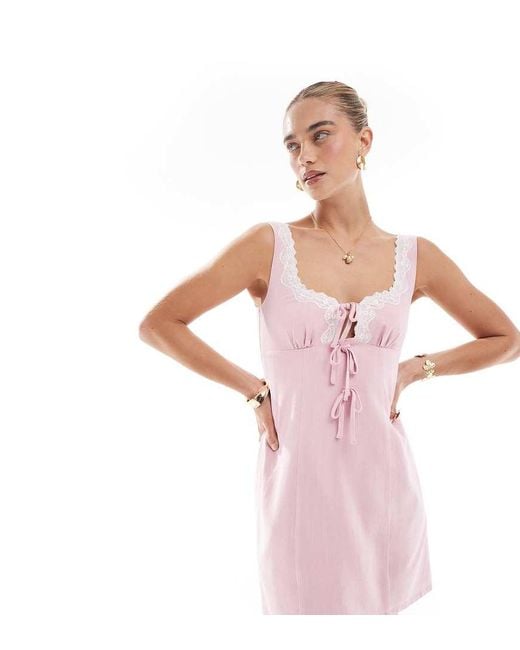The Frolic Pink Exclusive Linen Blend Contrast Lace Trim Tie Front Detail Mini Dress