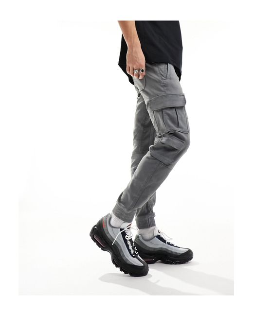Pantalon cargo à poches contrastantes Bershka pour homme en coloris Black