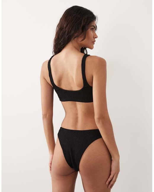 The Frolic Black Exclusive Crinkle Metal Flower Trim Scoop Neck Bikini Top