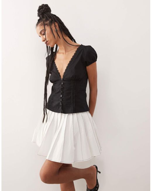 Amy Lynn White ziggy Contrast Pleated Mini Skirt