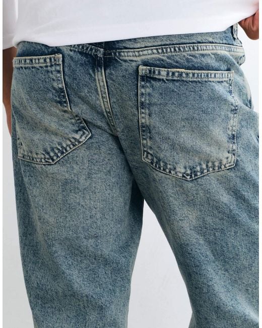 Jean bootcut délavé clair ASOS pour homme en coloris Blue