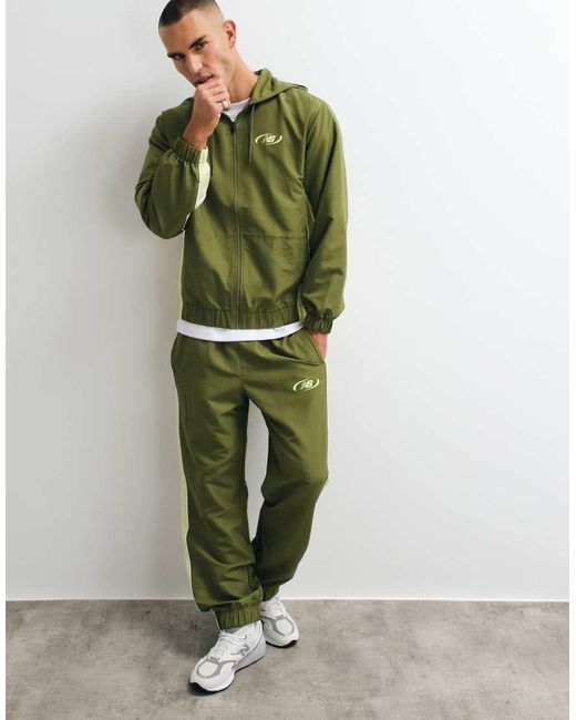New Balance Green Trackside Woven Pant for men