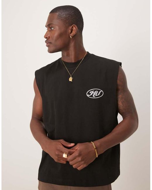 Camiseta Negra De Corte Cuadrado Extragrande Sin Mangas Con Estampado Gráfico De Texto De ASOS de hombre de color Black