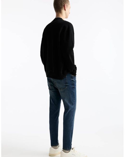 Jeans Carrot Slavato di Pull&Bear in Black da Uomo