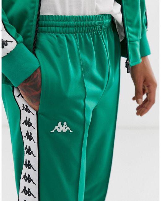 Kappa – Banda Astoria – Schmal geschnittene, grüne Jogginghose mit aufgesetzten Logostreifen in Green für Herren
