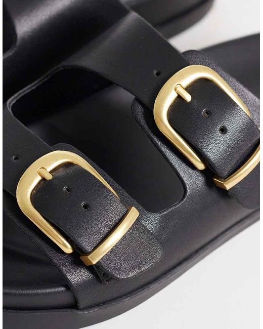 Schuh Black Trish Double Buckle Flat Sandal
