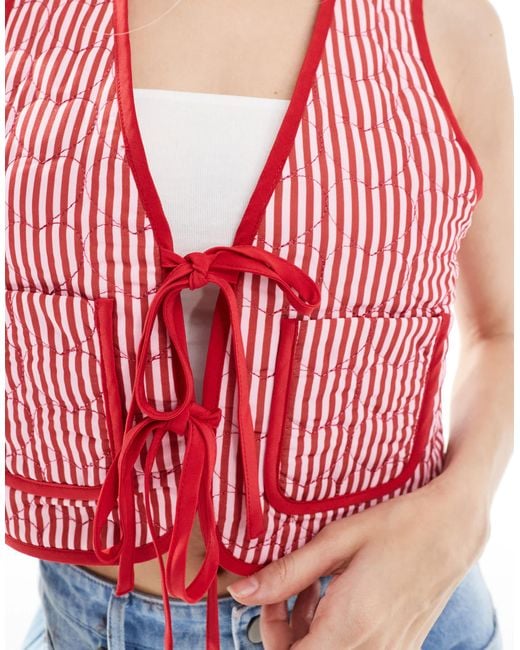 The Frolic Red – exklusiv – wendbare weste mit streifen, blumen-print und gestepptem herzmuster