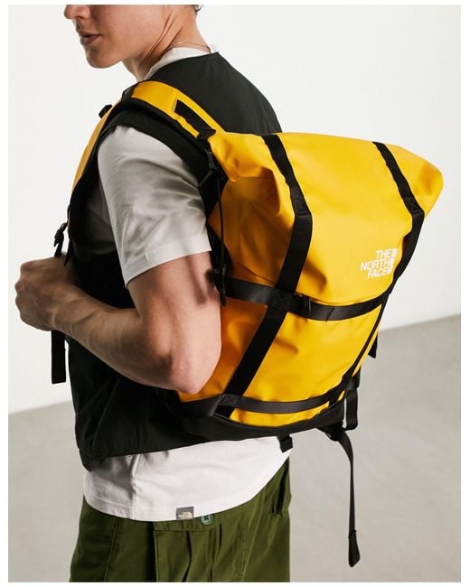 The North Face Yellow Commuter Roll Top Backpack for men