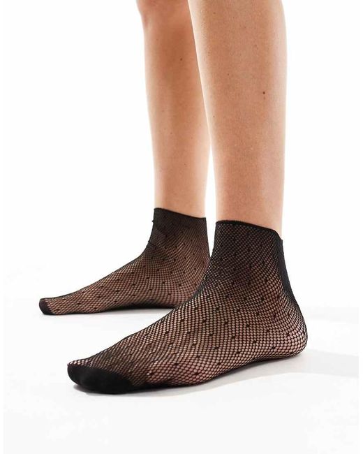 Calcetines Negros Con Patrón De Lunares Muy Pequeños De Rejilla Transparente De Pretty Polly de color Brown