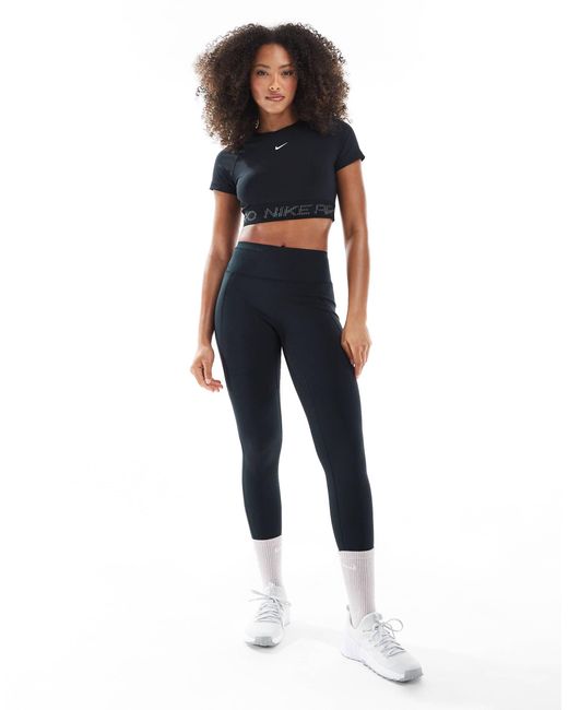 Nike - pro - t-shirt crop top Nike en coloris Black