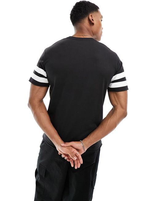 Camiseta negro lavado con diseño universitario slateno Ellesse de hombre de color Black