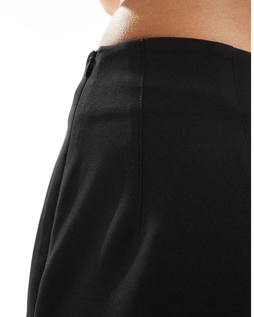 Mini-jupe ajustée à taille haute ASOS en coloris Black