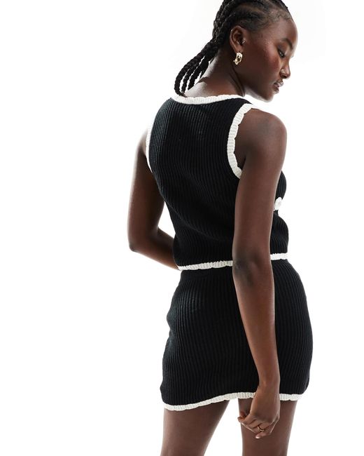 Exclusivité - - mini-jupe d'ensemble The Frolic en coloris Black