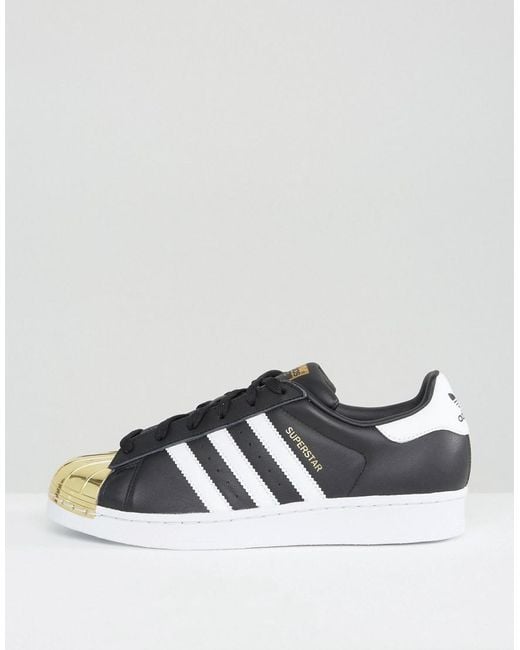 adidas Originals Originals Black Superstar Sneakers With Gold Metal Toe Cap  | Lyst