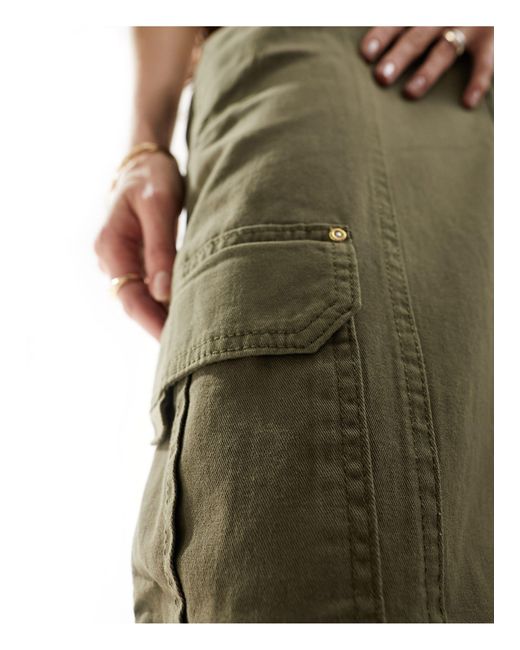 Pantalones s cargo con cinturón y bajos ajustados River Island de color Green