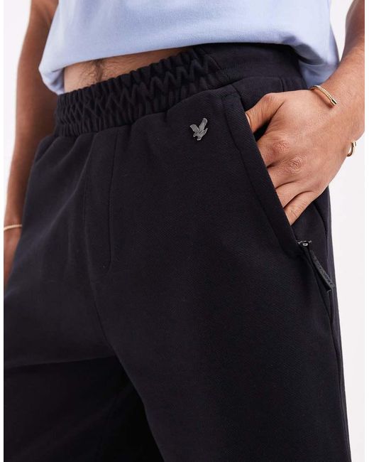 Lyle & Scott Blue Mid Bottoms Diagonal Interlock Shorts for men