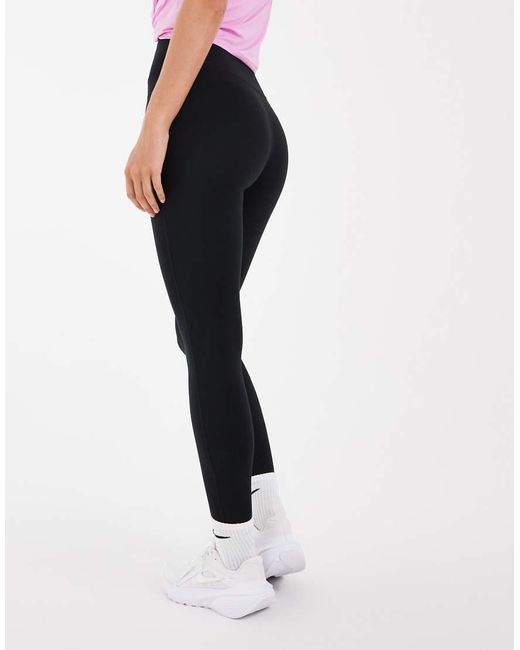 Leggings Con Estribo En Nike de color Pink