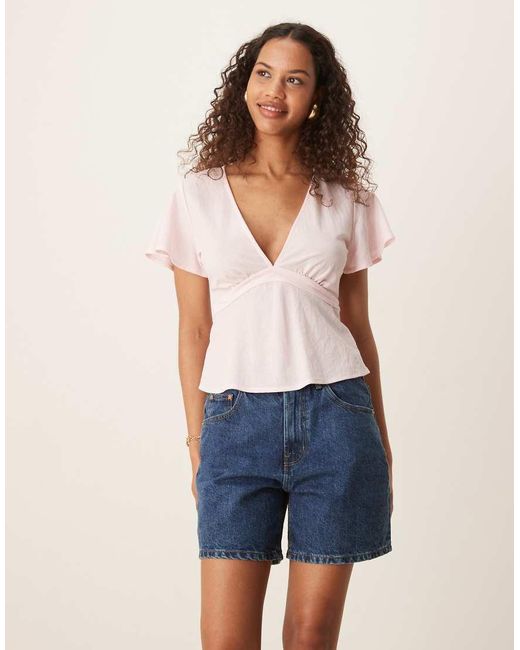 Top A Maniche Corte Chiaro Con Scollo A V E Allacciatura Sul Retro Con Fiocco di Gina Tricot in Blue