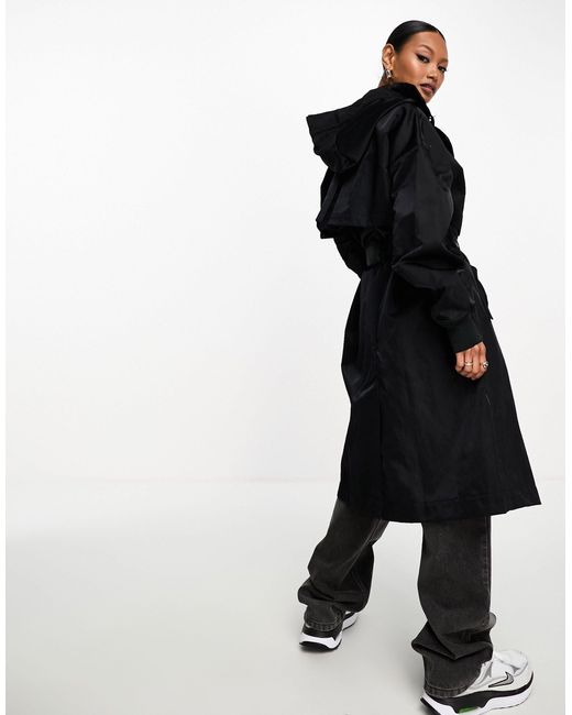 Trench-coat avec petit logo virgule Nike en coloris Black