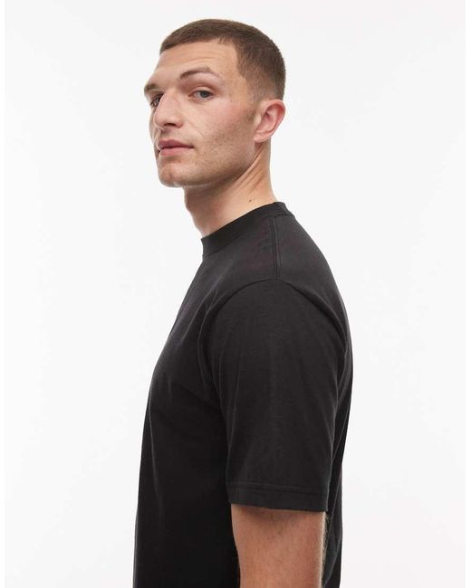 Camiseta Negra Con Estampado Gráfico Del Logo En El Centro No Dice De Vans de color Black