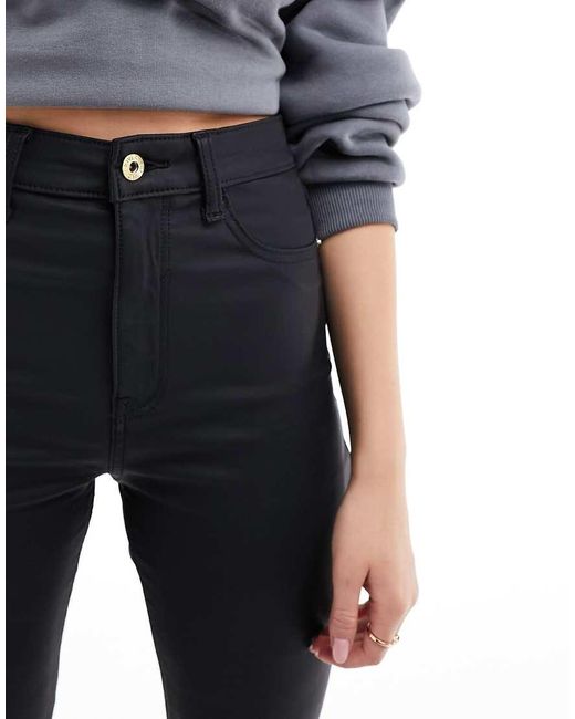 Vaqueros Negros De Campana Y Talle Alto Con Acabado Revestido De River Island de color Black