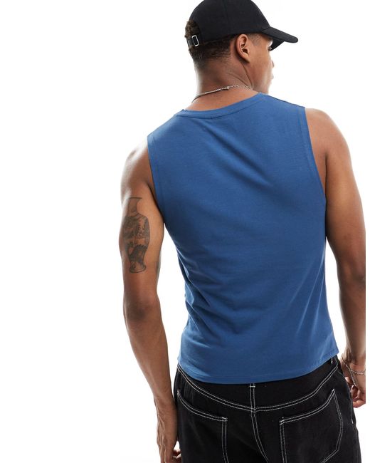 Camiseta ajustada sin mangas con cuello ASOS de hombre de color Blue