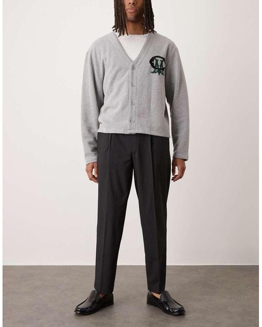 Pantalones De Vestir De Corte Tapered Extragrande Con Raya Diplomática Y Pinzas De ASOS de hombre de color Black