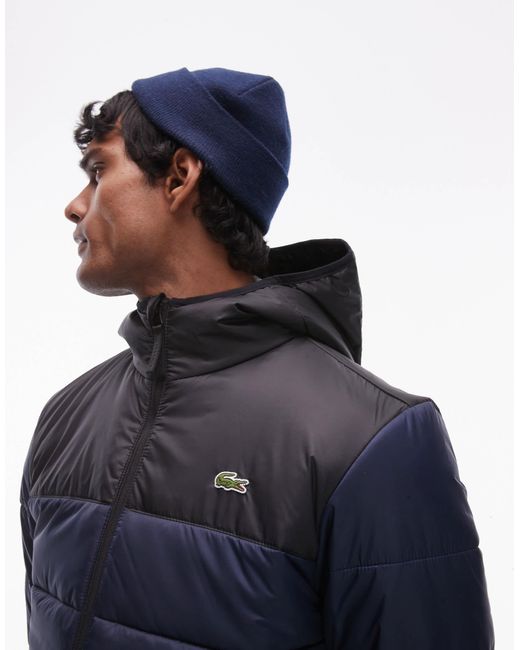 Lacoste – essentials – gesteppte puffer-jacke mit em blockfarben-design in Blue für Herren