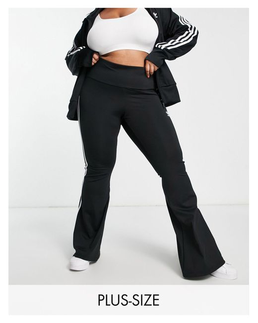 adidas Originals Plus Adicolor Three Stripe Flared legging in Black | Lyst Canada