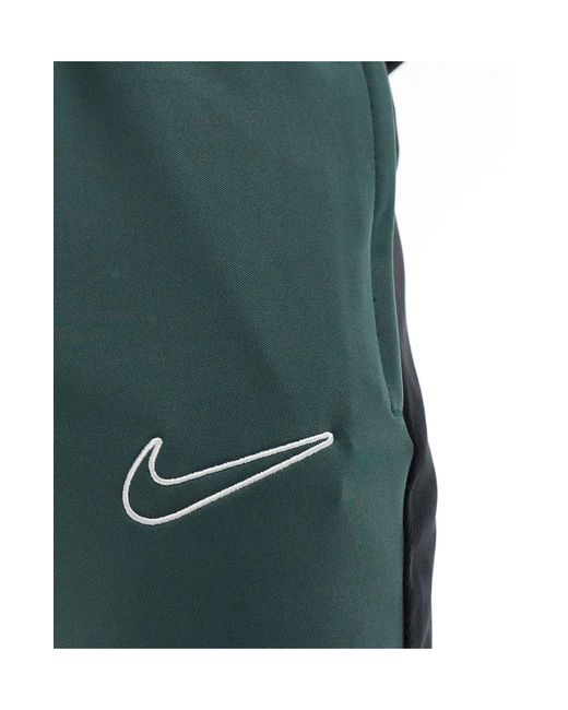Academy - joggers dri-fit scuro a pannelli di Nike Football in Black da Uomo