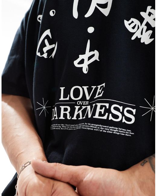 T-shirt oversize nera con stampa stile souvenir bianca sul retro di ASOS in Black da Uomo