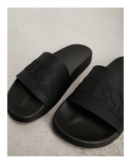 Sandalias negras con logo Guess de hombre de color Black