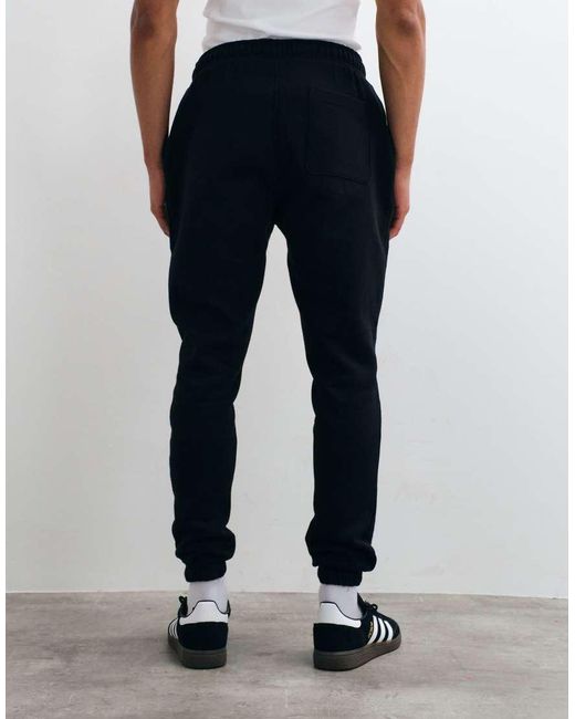 Joggers Negros Básicos De Corte Slim De ASOS de hombre de color Black