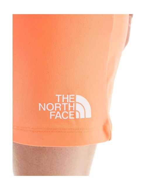 Training - mountain athletic - short moulant - vif The North Face en coloris Orange