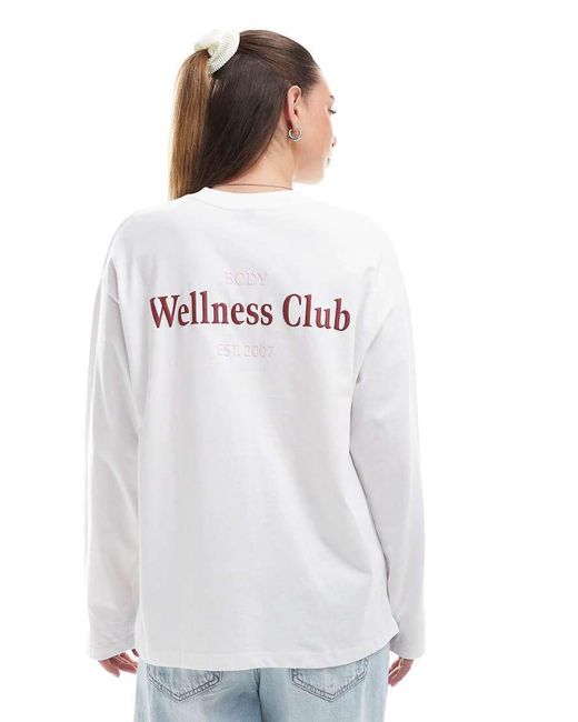 Camiseta Blanca De Manga Larga Con Cuello Redondo Y Estampado Gráfico "Wellness Club" De Cotton On Cotton On de color Blue