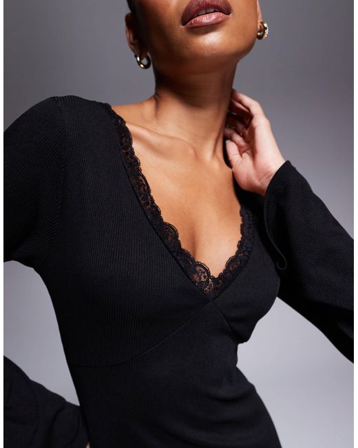 Robe longue cotelee et evasee en tissu doux a col en v ASOS en coloris Noir Lyst