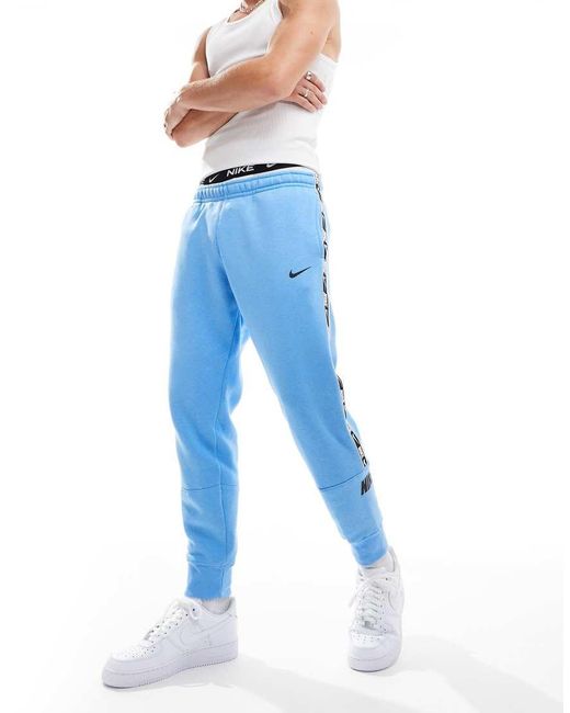 Nike Repeat Logo Joggers in Blue for Men Lyst UK