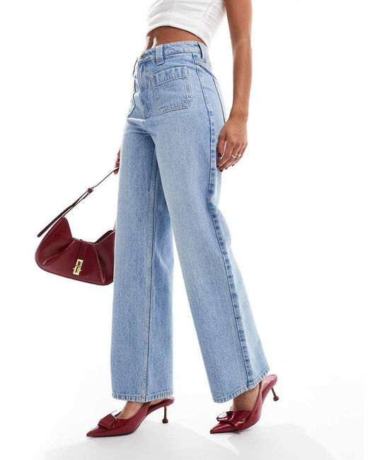 Jeans A Fondo Ampio Medio Con Tasche Applicate di New Look in Blue