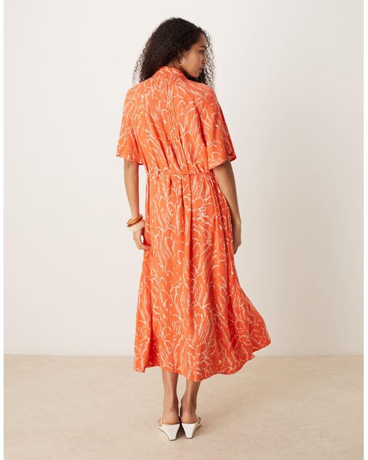 Robe boutonnée devant à ceinture et manches évasées - orange fleuri Y.A.S