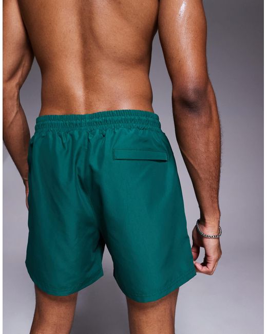 The Couture Club Green Reactive Emblem Swim Shorts for men