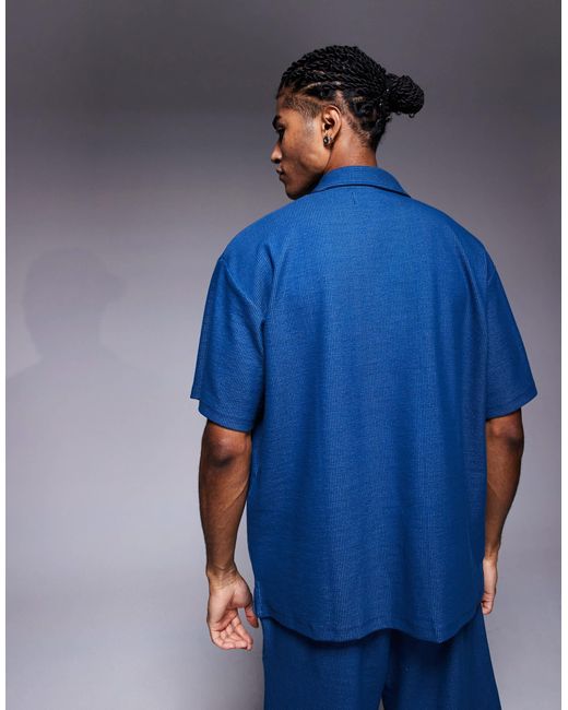 ADPT Blue Split Neck Texture Polo Shirt for men