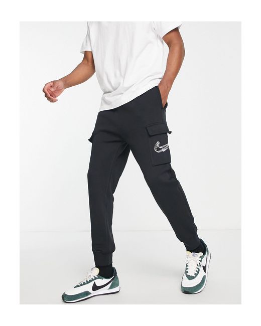 Nike 3d Swoosh Fleece Cargo joggers in Black for Men Lyst UK